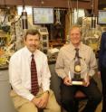 Iowa State University researchers, left to right, Anthony L. Pometto III, Hans van Leeuwen and Mary Rasmussen display the 2008 Grand Prize for University Research recently presented to their research team by the American Academy of Environmental Engineers. Not pictured is Samir Khanal, a former Iowa State research assistant professor who's now at the University of Hawai'i at Manoa. Iowa State University researchers, left to right, Anthony L. Pometto III, Hans van Leeuwen and Mary Rasmussen display the 2008 Grand Prize for University Research recently presented to their research team by the American Academy of Environmental Engineers. Not pictured is Samir Khanal, a former Iowa State research assistant professor who's now at the University of Hawai'i at Manoa.