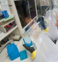 University of Michigan researcher David Aronoff, M.D., uses an oxygen-free "glove box" to study Clostridium sordellii bacteria. These bacteria normally don't cause serious infection, but overwhelmed the immune systems of several women taking the drug misoprostol.