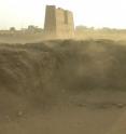 View towards the east, Tell Edfu in the foreground with the pylon of the Ptolemaic temple in the background. View towards the east, Tell Edfu in the foreground with the pylon of the Ptolemaic temple in the background.