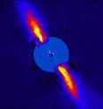 This composite image represents the close environment of Beta Pictoris as seen in near infrared light. This very faint environment is revealed after a very careful subtraction of the much brighter stellar halo. The outer part of the image shows the reflected light on the dust disc, as observed in 1996 with the ADONIS instrument on ESO's 3.6 m telescope; the inner part is the innermost part of the system, as seen at 3.6 microns with NACO on the Very Large Telescope. The newly detected source is more than 1000 times fainter than Beta Pictoris, aligned with the disc, at a projected distance of 8 times the Earth-Sun distance. Both parts of the image were obtained on ESO telescopes equipped with adaptive optics. This composite image represents the close environment of Beta Pictoris as seen in near infrared light. This very faint environment is revealed after a very careful subtraction of the much brighter stellar halo. The outer part of the image shows the reflected light on the dust disc, as observed in 1996 with the ADONIS instrument on ESO's 3.6 m telescope; the inner part is the innermost part of the system, as seen at 3.6 microns with NACO on the Very Large Telescope. The newly detected source is more than 1000 times fainter than Beta Pictoris, aligned with the disc, at a projected distance of 8 times the Earth-Sun distance. Both parts of the image were obtained on ESO telescopes equipped with adaptive optics.