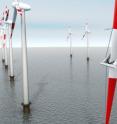 A robot inspects a wind energy converter's rotor blades for possible damage.