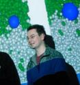 Stefan Bon (left) and David Cheung (right) pose against an image from their paper. Stefan Bon (left) and David Cheung (right) pose against an image from their paper.
