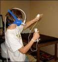 A participant in the study of active video games plays Nintendo Wii Boxing. Researchers studied energy consumption, heart rate and exertion during the games.