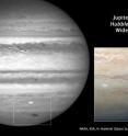 This Hubble picture, taken on July 23, is the sharpest visible-light picture taken of the atmospheric debris from a comet or asteroid that collided with Jupiter on July 19. This is Hubble's first science observation following its repair and upgrade in May. The image was taken with the new Wide Field Camera 3. 

The combination of the Hubble data with mid-infrared images from ground-based telescopes will give astronomers an insight into changes of the vertical structure of Jupiter's atmosphere due to the impact. The expanding spot is about twice the length of the whole of Europe.

First discovered by Australian amateur astronomer Anthony Wesley, the feature is the impact site and "backsplash" of material from a small object that plunged into Jupiter's atmosphere and disintegrated.

The only other time in history such a feature has been seen on Jupiter was in 1994 during the collision of fragments from comet Shoemaker-Levy 9. The spot looks strikingly similar to comet Shoemaker-Levy 9's impact features. The details seen in the Hubble view shows lumpiness in the debris plume caused by turbulence in Jupiter's atmosphere.

The impactor is estimated to be the size of several football fields. The force of the explosion on Jupiter was thousands of times more powerful than the suspected comet or asteroid that exploded in June 1908 over the Tunguska River Valley in Siberia.

This is a natural colour image of Jupiter as seen in visible light.