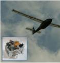 This photo shows the Ion Tiger in flight. The 550-watt fuel cell is show in the  
box in the lower left corner.