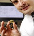 Georgia Tech's Gregory Durgin designed a system capable of simultaneously detecting hundreds of RFID tags and rapidly testing new RFID tag antenna prototypes, like the one he’s holding.