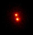 Infrared image of the very low-temperature binary 2MASS 1534-2952AB, composed of two methane brown dwarfs. This was obtained with the laser guide star adaptive optics system on the Keck II Telescope, located on Mauna Kea, Hawaii. The image is 1.5 arc seconds across (about 1/1,000 of the size of the moon), and the binary's separation is about 0.2 arc seconds. Each component of the binary has a mass of about 3 percent the mass of the sun and emits about 1/100,000 the energy of the sun. These are the coolest free-floating objects ever directly weighed outside the solar system.