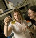 Sara Morey, left, and Claudia Gunsch examining the results of their latest experiment.