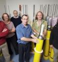 Lead author Dr Catia Domingues (far right) with co-authors of the <i>Nature</i> paper -- (left to right) Jeff Dunn, Susan Wijffels, Neil White, Argo engineer Vito Dirita and Paul Barker -- with Argo robotic floats, a key tool for scientists observing change in ocean conditions.