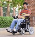 Georgia Tech Electrical and Computer Engineering graduate student Xueliang Huo moves his tongue to direct the Tongue Drive system to move the powered wheelchair in a different direction.