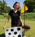 Jessica K. Witt, an assistant professor of psychological sciences who studies perception in athletes, has found that when golfers play well they are more likely to perceive the hole as being larger. After playing a round of golf, 46 golfers were asked to select the correct hole size based on black circles that ranged in size from 9-13 centimeters. Those who played well selected the larger holes.