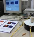 A portable magnetic resonance spectrometer (back right) allows investigations to be performed in the field. The magnet is housed in the circular base (in the foreground).