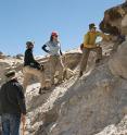 The team at the Quelccaya Ice Cap obtain a sample to be used in radiocarbon dating.