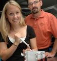 Queen's University Pharmacology and Toxicology professor Donald Maurice supervises as Ph.D. student Lindsay Wilson (Pathology and Molecular Medicine) loads a gel to detect the presence of proteins in a cell.