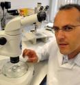 Dr. Stefan Przyborski, Durham University, with the molecule EC23, in a laboratory setting.