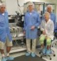 Professors, from left, David Stuart, Claudio Compagnari, and Jeff Richman, and engineers Susanne Kyre and Dean White in the UCSB cleanroom lab where detectors for the Compact Muon Solenoid were painstakingly assembled