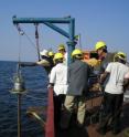 Brown-led researchers and staff take cores from Lake Tanganyika, the world's second-deepest lake. Each core was 8 m (26 feet) long and taken at depths of 650 m (2,133 feet). The cores were collected in 2004 as part of the Nyanza Project and were analyzed in 2006 and 2007.