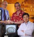 Professor Al Merrill, principal research scientist Cameron Sullards (left to right standing) and research scientist Yanfeng Chen display mass spectrometry results.