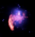 Superimposed false-color images of the galaxy cluster A521. The blue color represents hot gas typical of many galaxy clusters detected by the Chandra X-ray Observatory. The shape of the X-ray emission indicates that the cluster has undergone a recent collision or "merger event" that could generate turbulent waves. The red represents radio emission at 125 cm wavelength. The bright radio source on the lower left periphery of the X-ray gas is a separate source. The region of radio emission generated by turbulent waves is located at the center of the cluster, where the colors overlap.