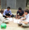 Dr. Peter Davis (far right) spent several months in Bangladesh training researchers to inteview villagers for the study.