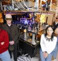 A research group from the Georgia Institute of Technology poses with optical equipment used to study quantum memory.