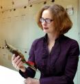 Smithsonian researcher Helen James studies a specimen of the now-extinct Kioea at the National Museum of Natural History in Washington, D.C.