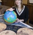 Brown University graduate student Bethany Ehlmann found the elusive mineral carbonate on Mars, bolstering the chances that life may have existed on the red planet and evidence of primitive forms may remain.