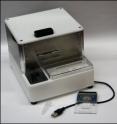 This portable magnetoresistive biosensor system utilizes an IC chip with an embedded giant magnetoresistance sensor array called the Bead ARray Counter (BARC).  BARC detects paramagnetic microparticles that are used to label protein or DNA molecules of interest in a sandwich-based assay. The BARC chip is housed in an assay cartridge which contains an integrated fluid cell, microfludics bus and a PCMCIA connector to quickly interface with the compact Bead Array Sensor System (cBASS). cBASS includes a low power electromagnet, an automated fluidic system, and supporting  electronics, all of which is controlled by a
computer through a USB interface.