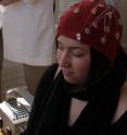 Patricia Spurio meditates while having her EEG measured.