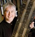Lori Kendall, a professor in the Graduate School of Library and Information Science, says despite the increased popularity of geek culture and the ubiquity of computers, the geek's close cousin, the nerd, still suffers from a negative stereotype in popular culture. Kendall holds a familiar tool of the nerd: a slide rule.