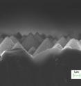 This image shows silicon pyramid structures etched for one minute using hydrogen fluoride/hydrogen peroxide/water solution. The resulting structure has roughness at the micro and nanometer scales.