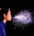 A girl sneezes.