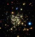 This image of the Arches Cluster of young, massive stars was obtained with NACO on ESO's Very Large Telescope. The field of view is 28 arcseconds. North is up and east is to the left. This image is a composite of infrared images obtained through J, H and K filters. The stars appear as bright cores surrounded by faint diffuse halos. This is typical of images obtained by adaptive optics instruments. The halo corresponds to light that was not fully corrected for the blurring effects of the Earth's atmosphere. This image of the Arches Cluster of young, massive stars was obtained with NACO on ESO's Very Large Telescope. The field of view is 28 arcseconds. North is up and east is to the left. This image is a composite of infrared images obtained through J, H and K filters. The stars appear as bright cores surrounded by faint diffuse halos. This is typical of images obtained by adaptive optics instruments. The halo corresponds to light that was not fully corrected for the blurring effects of the Earth's atmosphere.