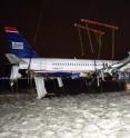 US Airways Flight 1549 being lifted out of the Hudson River after a bird strike incident caused its crash.