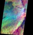 Pastel colors swirl across Mars, revealing differences in the composition and nature of the surface in this recently taken false-color infrared THEMIS image. Showing an area 31.9 kilometers (19.8 miles) by 88.3 kilometers (54.9 miles) in the southern highlands, the image is a result of the earlier orbit time for Mars Odyssey and THEMIS. In the image, dark areas mark exposures of relatively cold ground with abundant bare rock, while warmer basaltic sand covers the light blue-green regions. Reddish areas likely have a higher silica content, due either to a different volcanic composition or to weathering.
