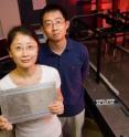 A team of Illinois researchers led by Nicholas X. Fang, left, a professor of mechanical science and engineering, have created the world's first acoustic "superlens." Doctoral student Shu Zhang holding the lens and Leilei Yin, a microscopist at Beckman Institute, were co-authors.