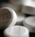 Scientists are reporting development of a new process for producing large batches of a new and potentially safer form of the common pain-reliever acetaminophen.