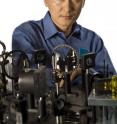 Dr. Chunlei Guo of the University of Rochester stands in front of his femtosecond laser.