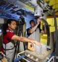 Georgia Tech graduate student Ryan Maladen (left) and physics assistant professor Daniel Goldman set up the high-speed x-ray imaging system to record the movements of sandfish below the sand surface.