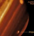 The scar from the probably impact appeared July 19 in Jupiter's southern hemisphere, and has grown to a size greater than the extent of the Pacific Ocean. This infrared image taken with Keck II on July 20 shows the new feature observed on Jupiter and its relative size compared to Earth.