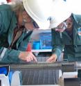 Lead scientists Lisa McNeill and Tim Byrne examine core retrieved from beneath the sea floor, from an earthquake-generating zone called the Nankai Trough, off the coast of Japan.