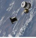 The ANDE-2 Pollux spherical spacecraft is deployed from Space Shuttle Endeavour on July 30, 2009, by the Internal Cargo Unit.