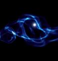 This computer-simulated image shows gas (blue) interacting with one of the first black holes (white) in the early universe, approximately 200 million years after the Big Bang.