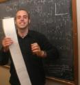 UC San Diego computer science Ph.D. student Stephen Checkoway clutches a print out demonstrating that his vote-stealing exploit that relied on return-oriented programming successfully took control of the reverse engineered voting machine.