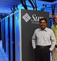 Srinivas Aluru, left, and Steve Nystrom have worked for months to connect cables and cooling hoses and otherwise get Iowa State University's second supercomputer up to speed.