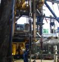 This image shows a worker lowering the tool to measure stress and pore fluid pressure in the subsurface. This image shows a worker lowering the tool to measure stress and pore fluid pressure in the subsurface.