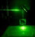 The near-infrared laser pathway into the cell culture plate, traced by visible laser for photo.