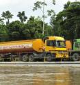 Oil development near Yasuni National Park (including a road through the park) has led to an increase of commercial hunting. This barge carries an oil truck on the nearby Napo River.