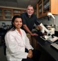 Dr. Jim West and Marianna Jahnke perform a biopsy on an embryo to collect two cells for genetic testing.