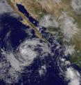 The GOES-11 satellite captured an image of Tropical Storm Marty (center) west of the Baja California peninsula on Sep. 18 at 12:45 p.m. EDT.